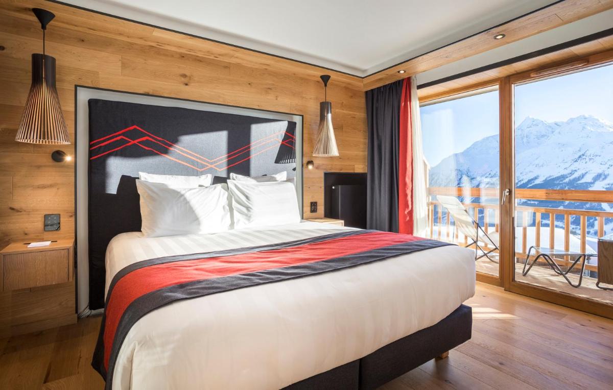 Un ou plusieurs lits dans un hébergement de l'établissement Hôtel Alparena & Spa - 4 étoiles