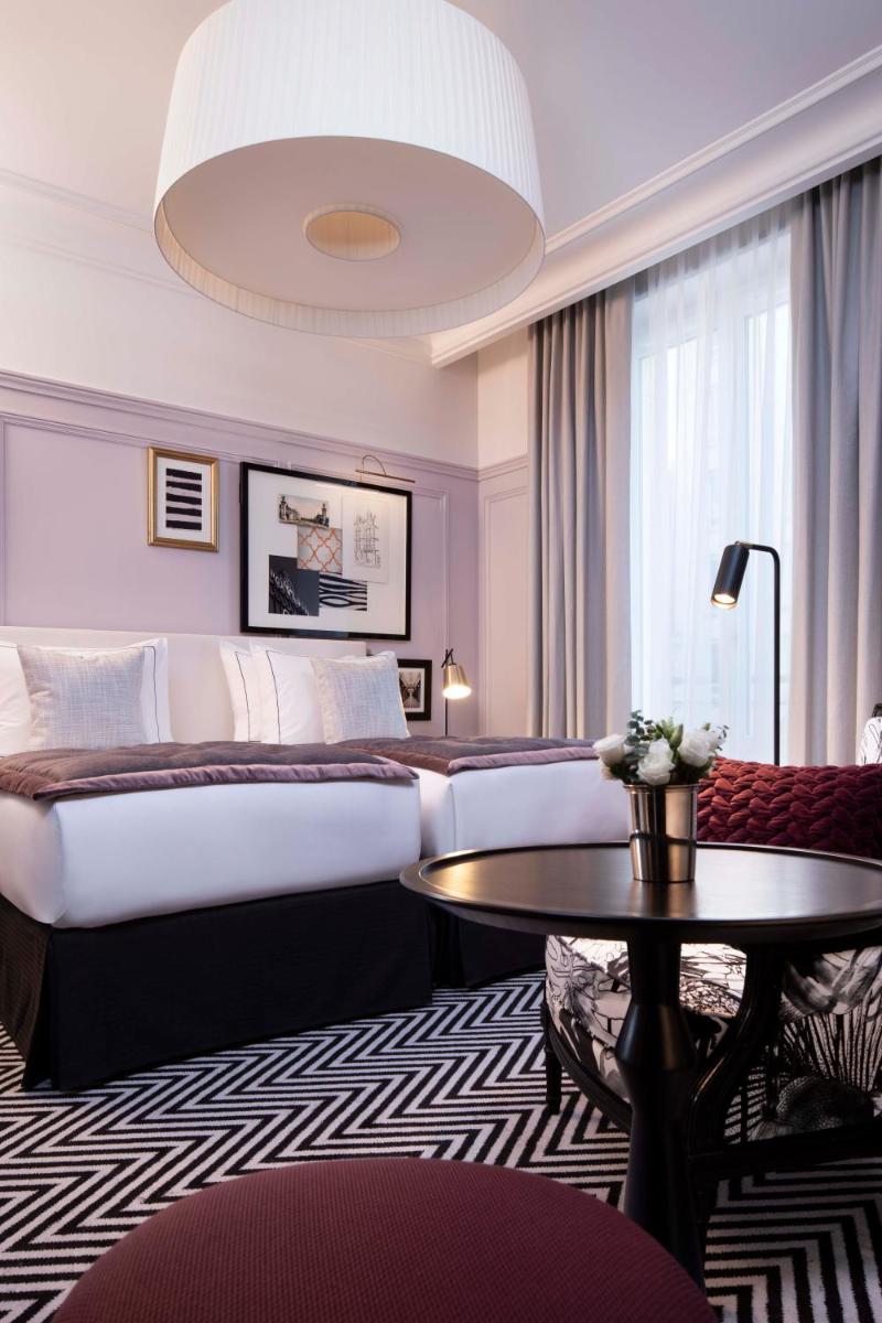 Un ou plusieurs lits dans un hébergement de l'établissement Le Damantin Hôtel & Spa