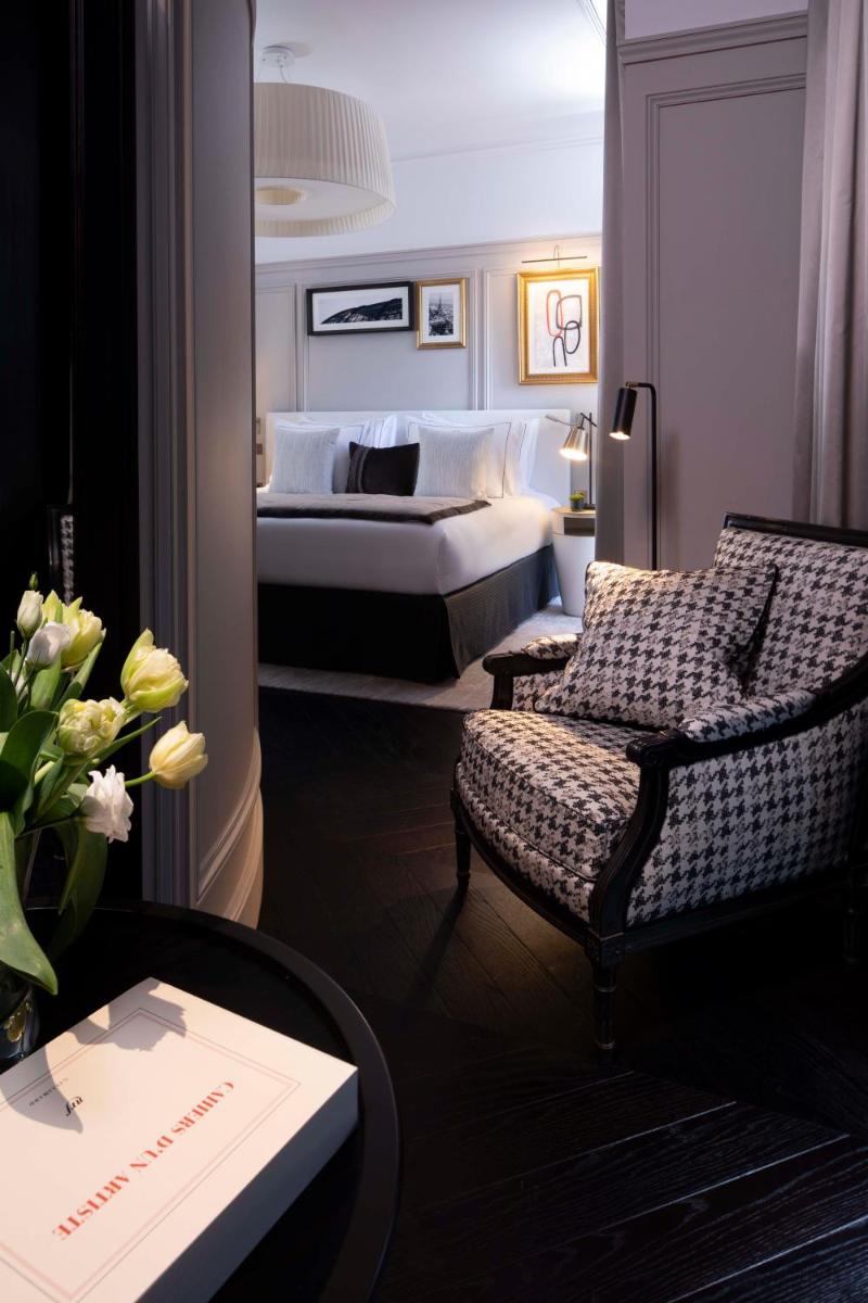 Un ou plusieurs lits dans un hébergement de l'établissement Le Damantin Hôtel & Spa