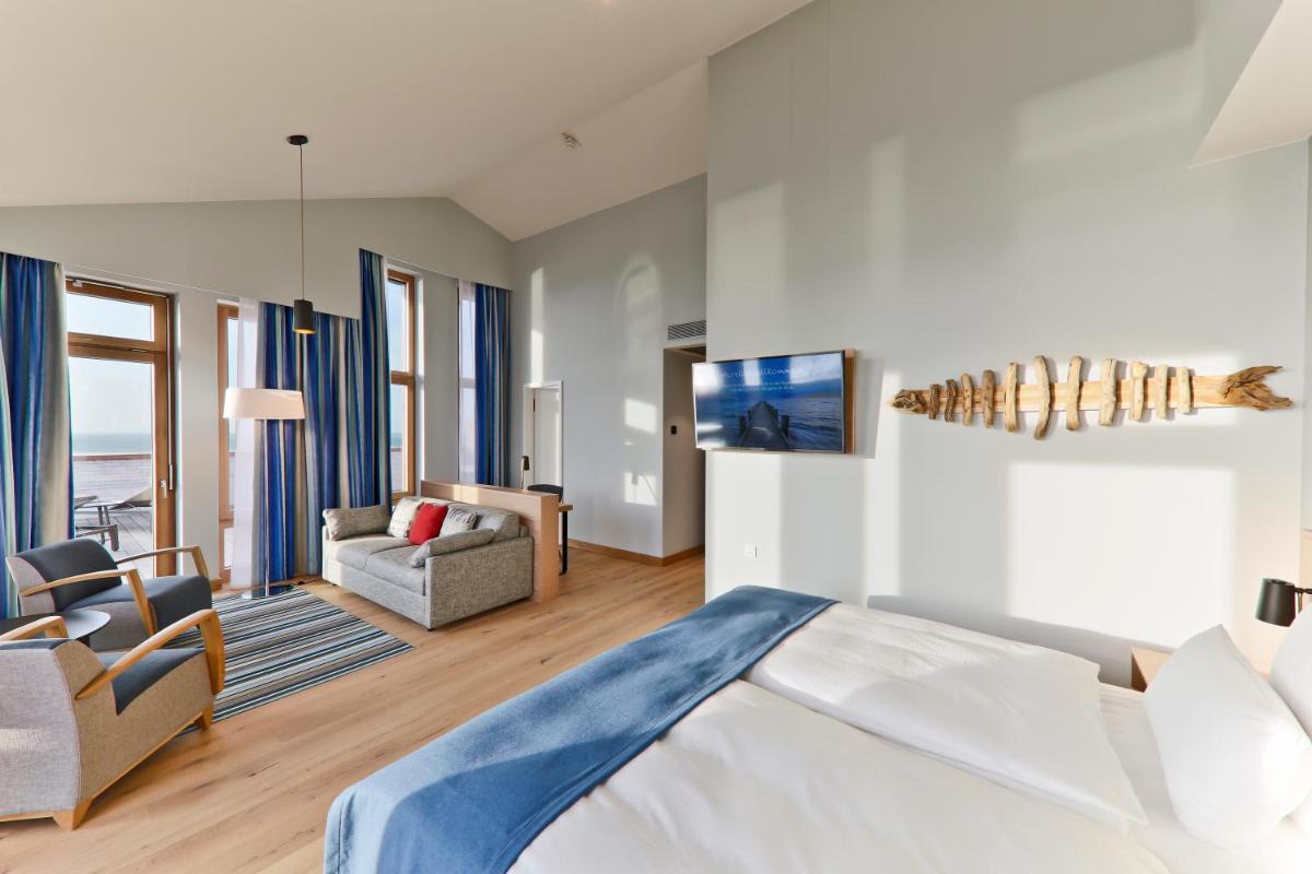 Ein Bett oder Betten in einem Zimmer der Unterkunft Upstalsboom Wyk auf Föhr