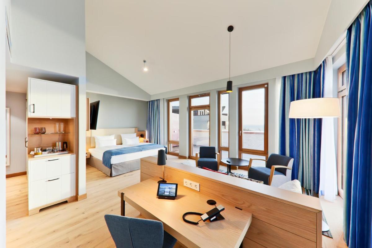 Ein Bett oder Betten in einem Zimmer der Unterkunft Upstalsboom Wyk auf Föhr