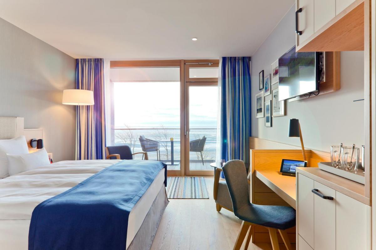 Ein Bett oder Betten in einem Zimmer der Unterkunft Upstalsboom Wyk auf Föhr