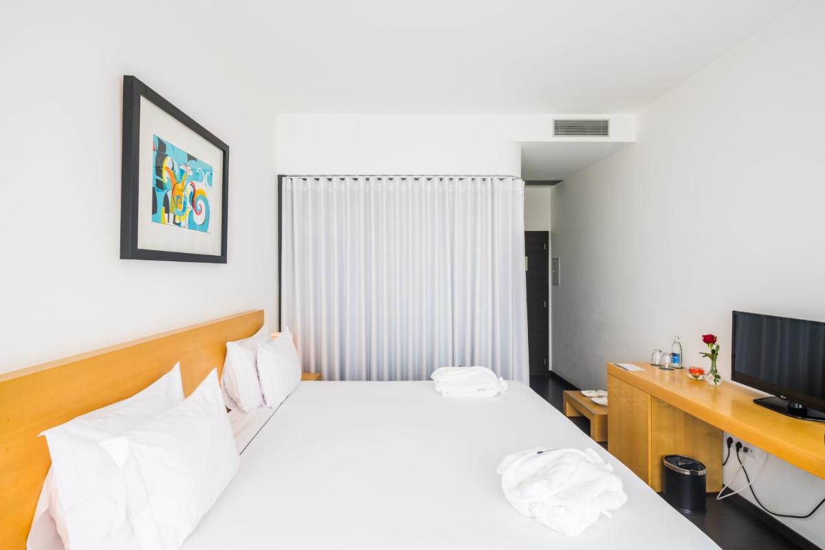 Uma televisão e/ou sistema de entretenimento em Boticas Hotel Art & SPA