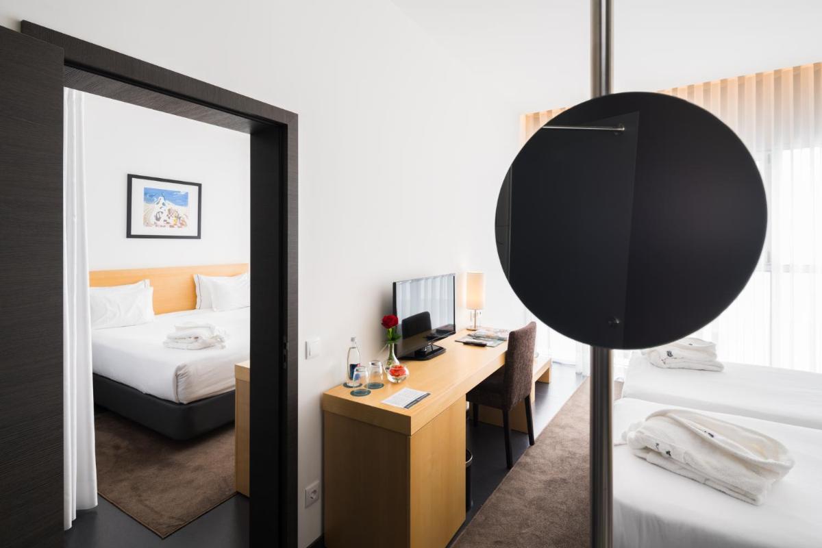 Uma cama ou camas num quarto em Boticas Hotel Art & SPA