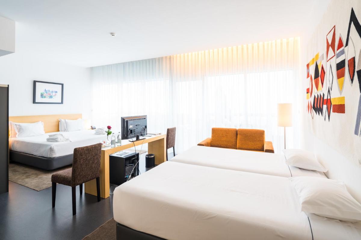 Uma cama ou camas num quarto em Boticas Hotel Art & SPA