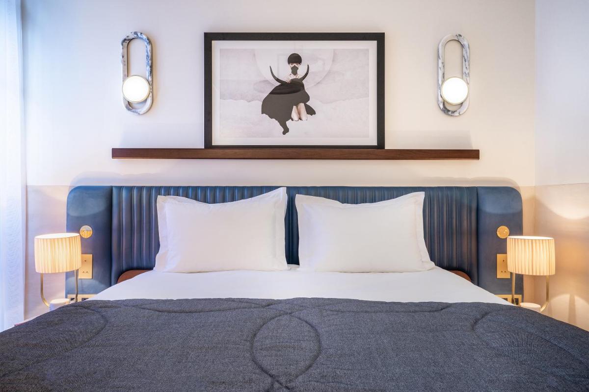 Un ou plusieurs lits dans un hébergement de l'établissement Maison Albar Hotels L’Imperator