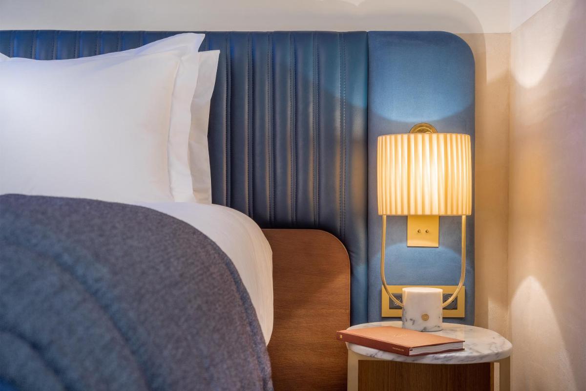 Un ou plusieurs lits dans un hébergement de l'établissement Maison Albar Hotels L’Imperator