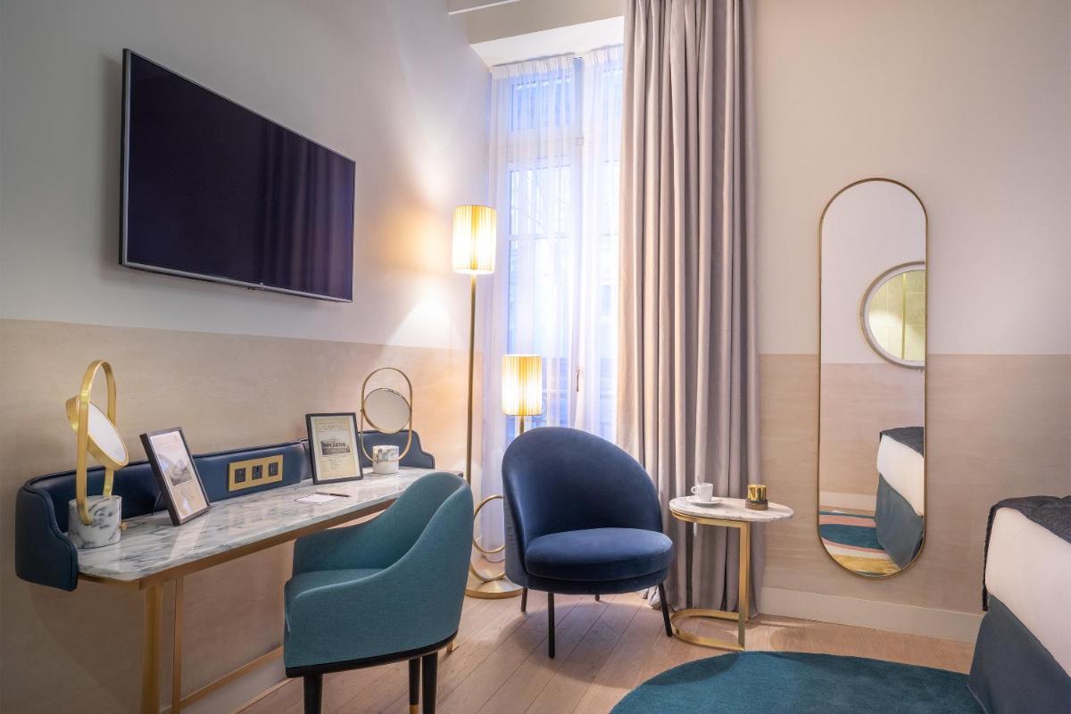 Télévision ou salle de divertissement dans l'établissement Maison Albar Hotels L’Imperator