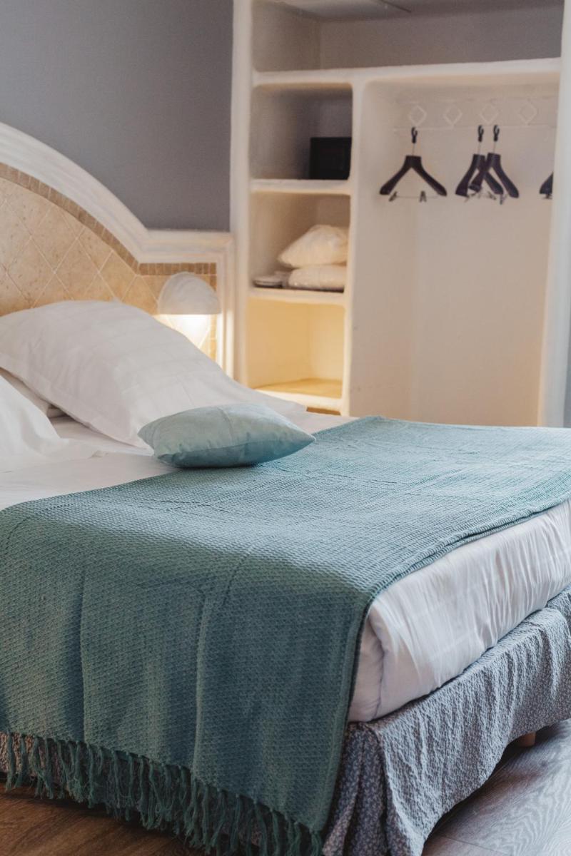 Un ou plusieurs lits dans un hébergement de l'établissement Ostella Spa & Resort