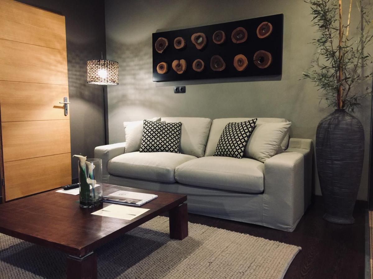 Coin salon dans l'établissement Domaine de Chalvêches Hôtel SPA 4*