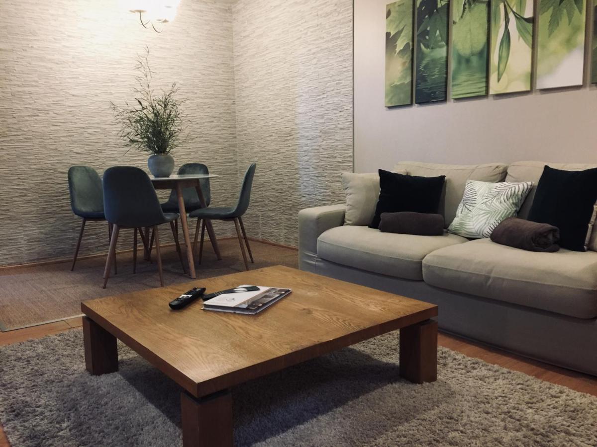 Coin salon dans l'établissement Domaine de Chalvêches Hôtel SPA 4*