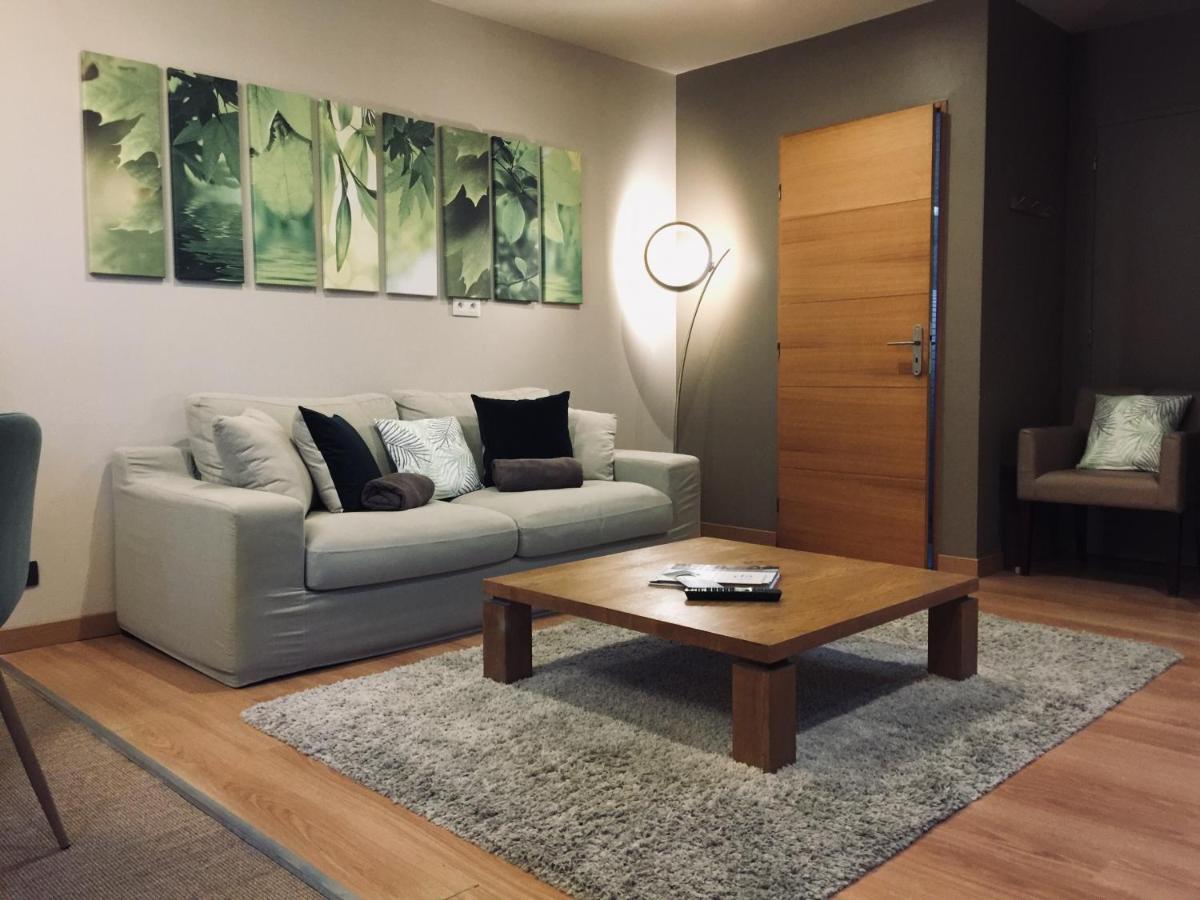 Coin salon dans l'établissement Domaine de Chalvêches Hôtel SPA 4*