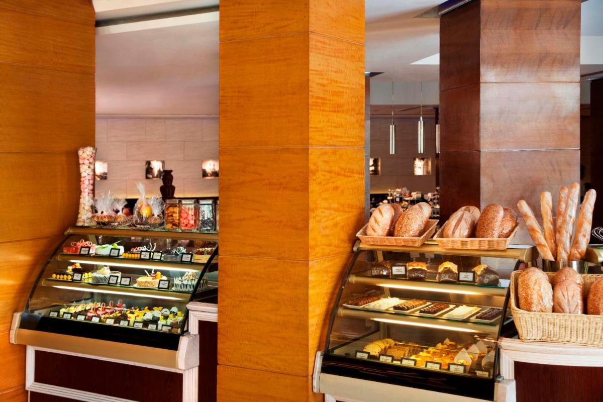 a bakery with many different types of bread and pastries at Radisson Blu Plaza Delhi Airport in New Delhi a bakery with many different types of bread and pastries at Radisson Blu Plaza Delhi Airport in New Delhi
