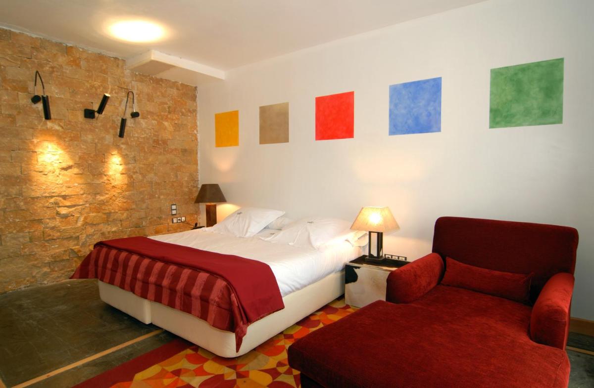 Cama o camas de una habitación en Hotel Casa del Abad