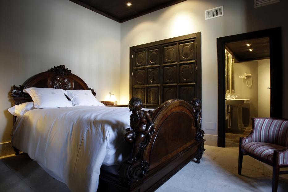 Cama o camas de una habitación en Hotel Palacio de Mengibar