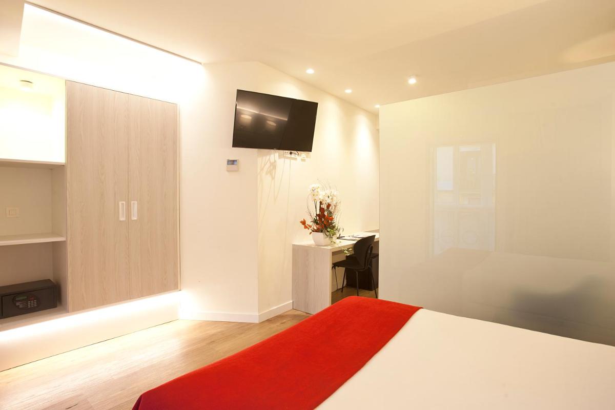 Cama o camas de una habitación en Hotel Pompaelo Plaza del Ayuntamiento & Spa