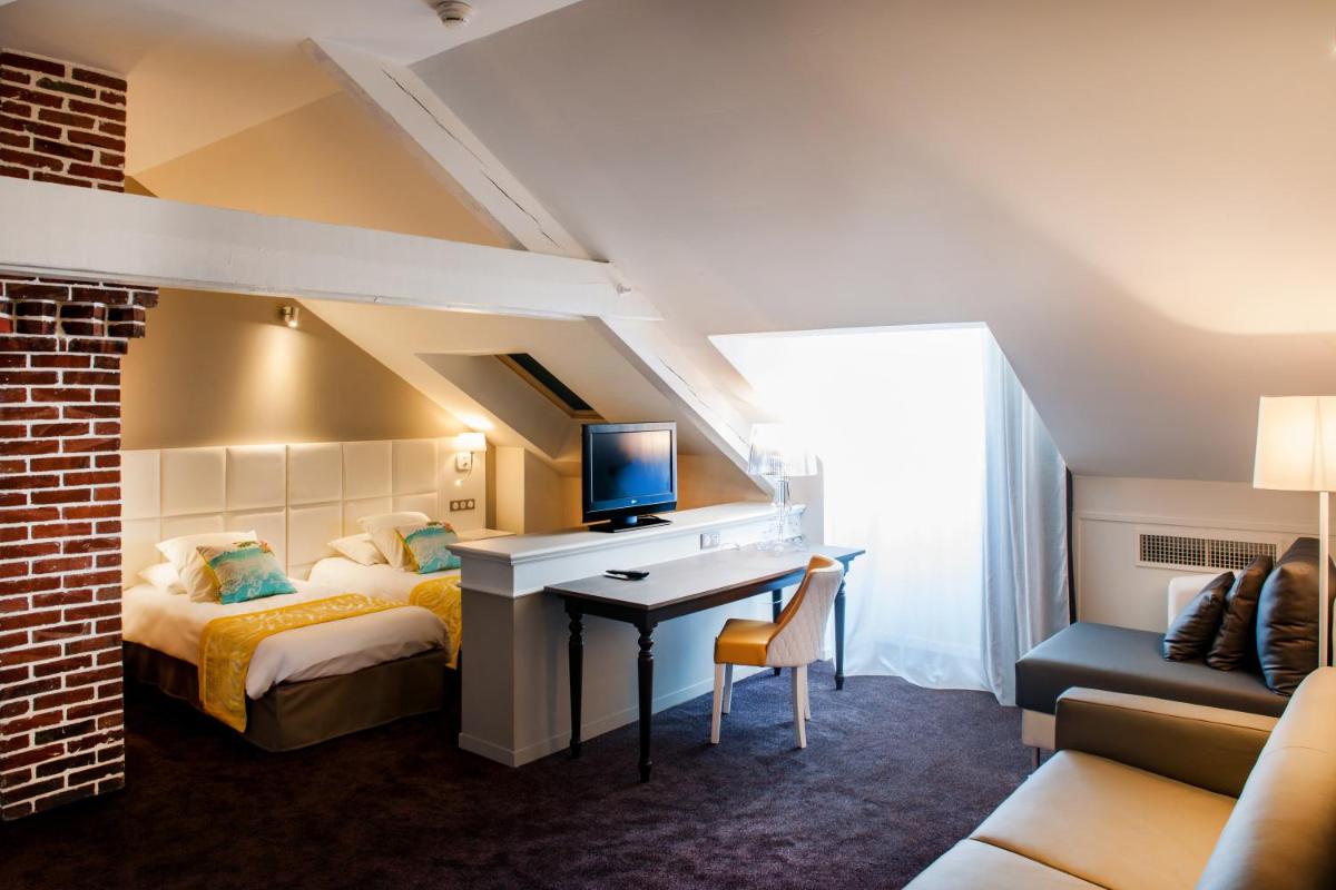 Un ou plusieurs lits dans un hébergement de l'établissement Grand Hotel Gallia & Londres