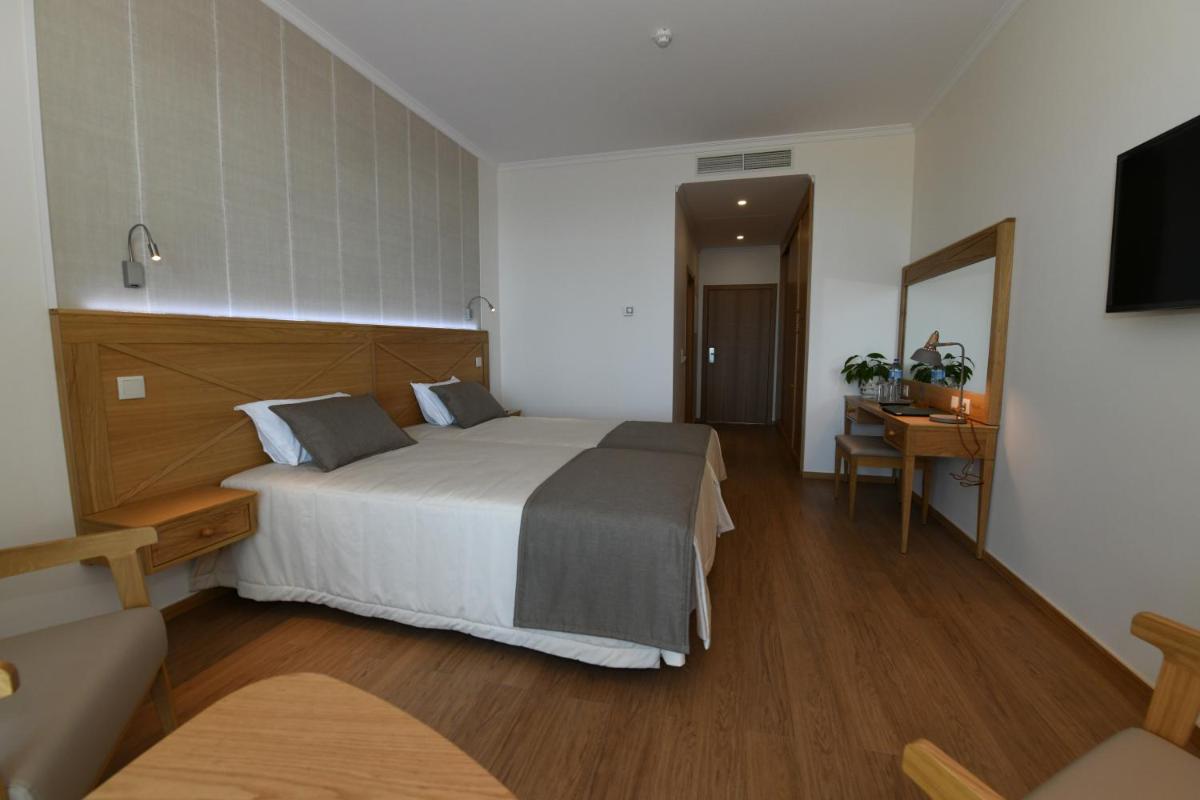 Uma cama ou camas num quarto em Hotel Do Campo
