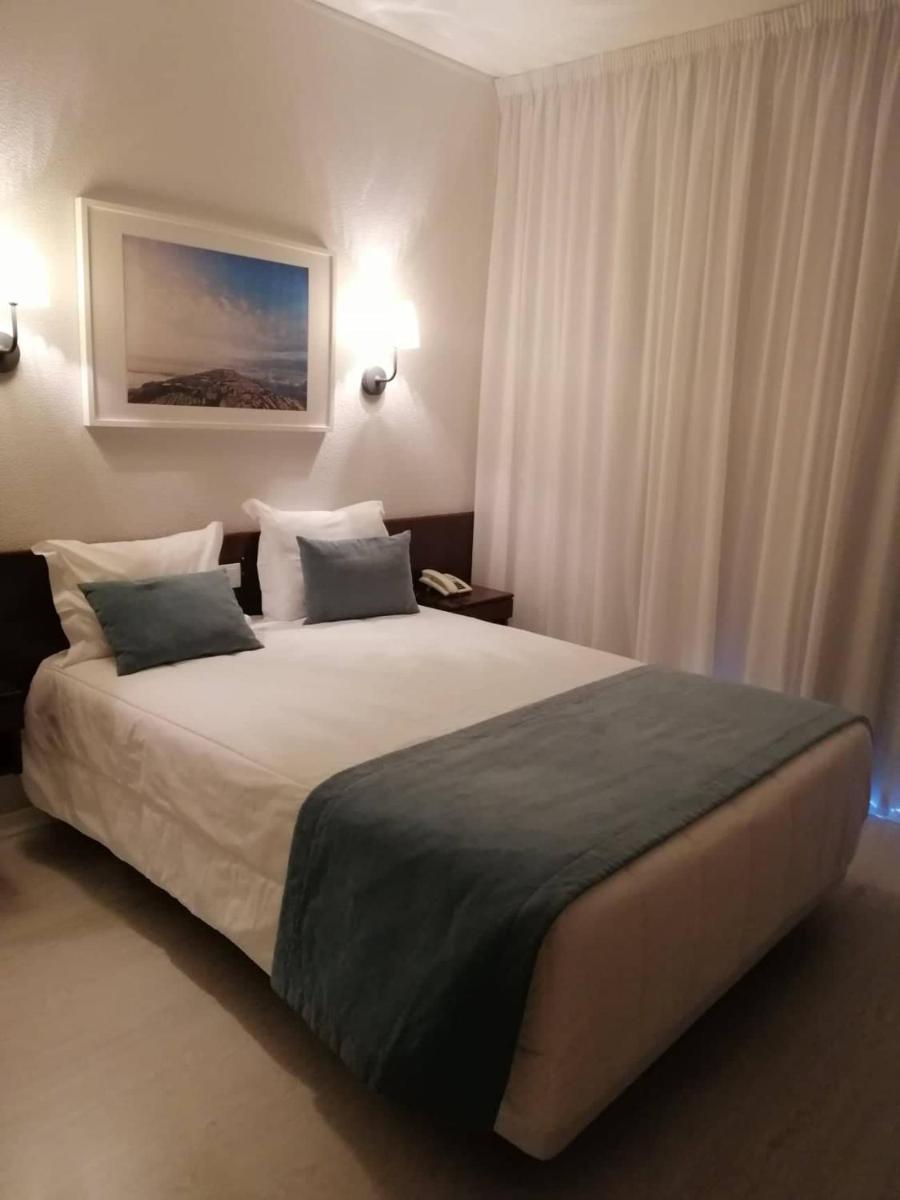 Uma cama ou camas num quarto em Hotel Costa de Prata 2 & Spa