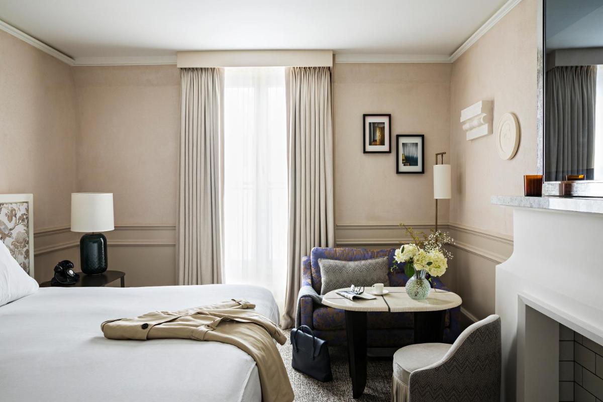 Un ou plusieurs lits dans un hébergement de l'établissement Sofitel Le Scribe Paris Opera