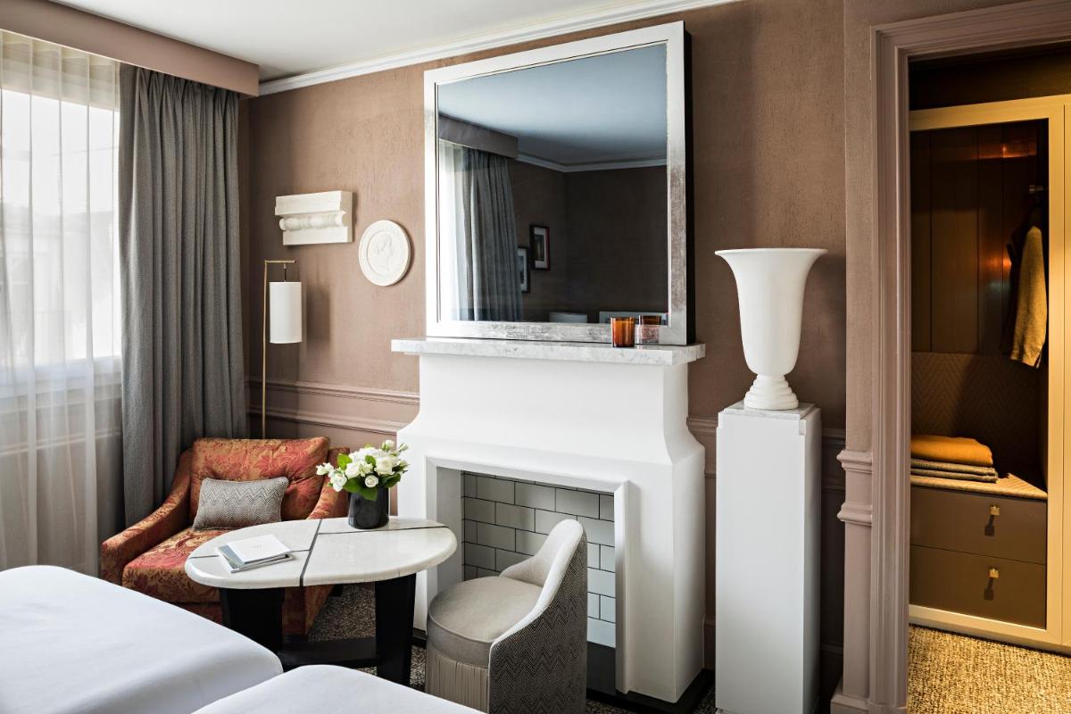 Un ou plusieurs lits dans un hébergement de l'établissement Sofitel Le Scribe Paris Opera