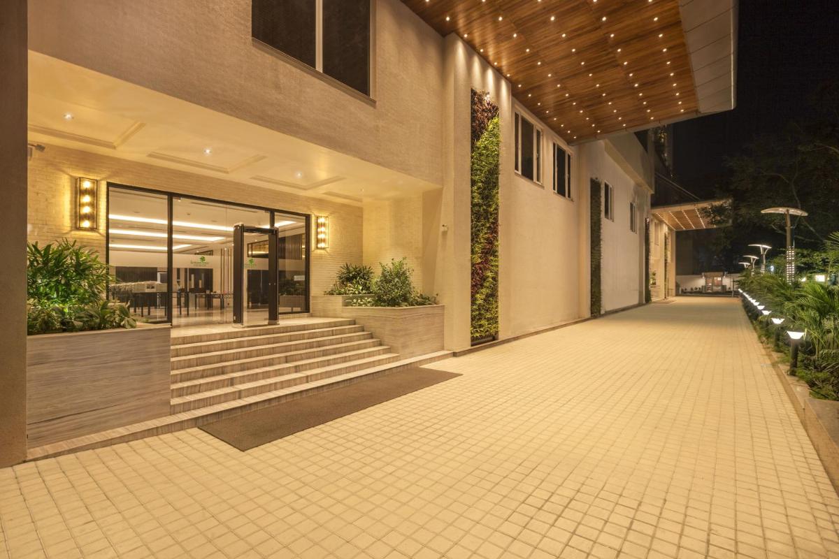 an empty hallway of a building at night at Lemon Tree Premier City Center Pune in Pune