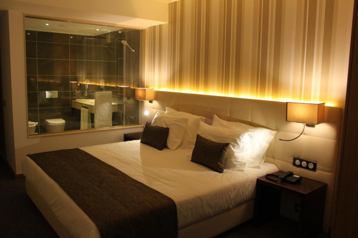 Uma cama ou camas num quarto em Hotel O Gato & Spa