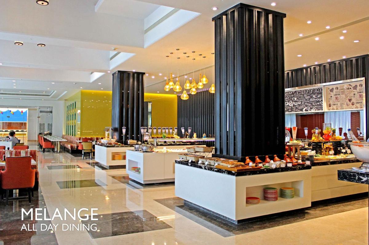 a restaurant with aasteryasteryasteryasteryasteryasteryasteryasteryasteryasteryasteryastery at Radisson Blu Bengaluru Outer Ring Road in Bengaluru