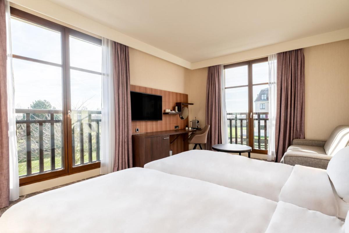 Un ou plusieurs lits dans un hébergement de l'établissement Hotel Paris Marne-la-Vallee by IHG