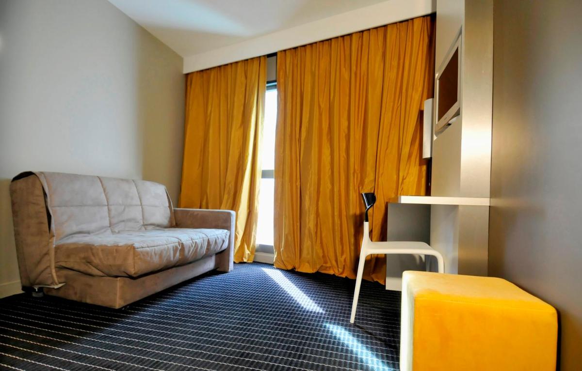 Coin salon dans l'établissement B&B HOME Lyon Centre Berthelot