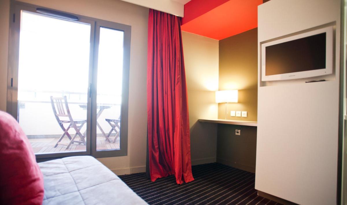 Télévision ou salle de divertissement dans l'établissement B&B HOME Lyon Centre Berthelot