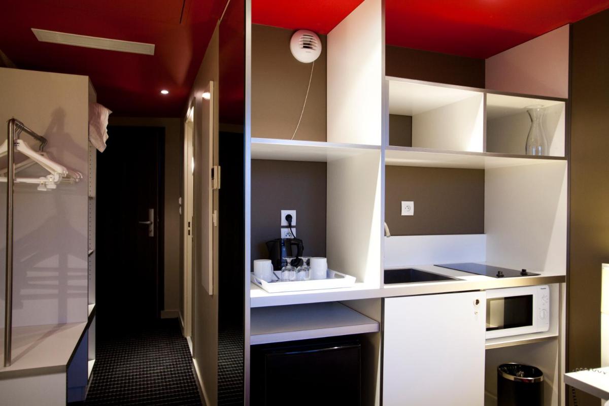 Cuisine ou kitchenette dans l'établissement B&B HOME Lyon Centre Berthelot