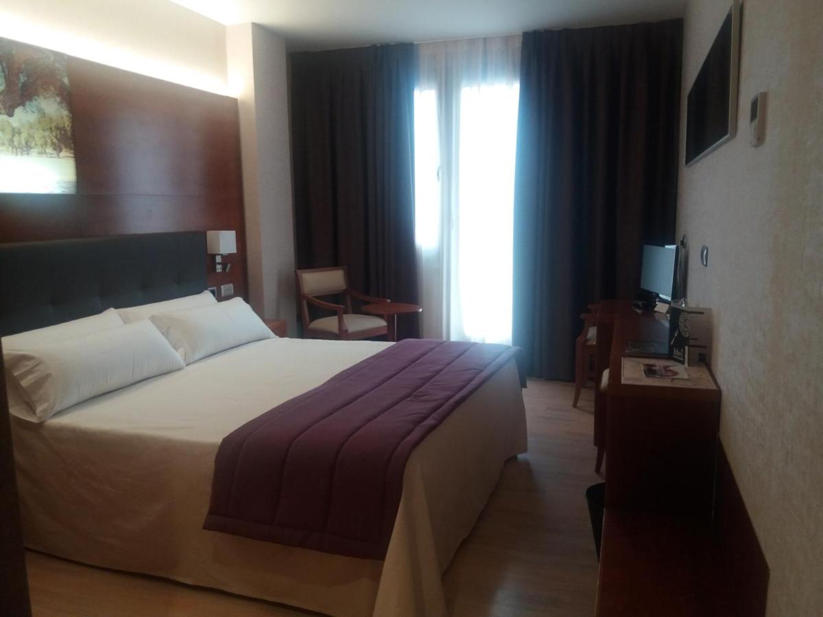 Cama o camas de una habitación en Hotel Balneario Valle del Jerte