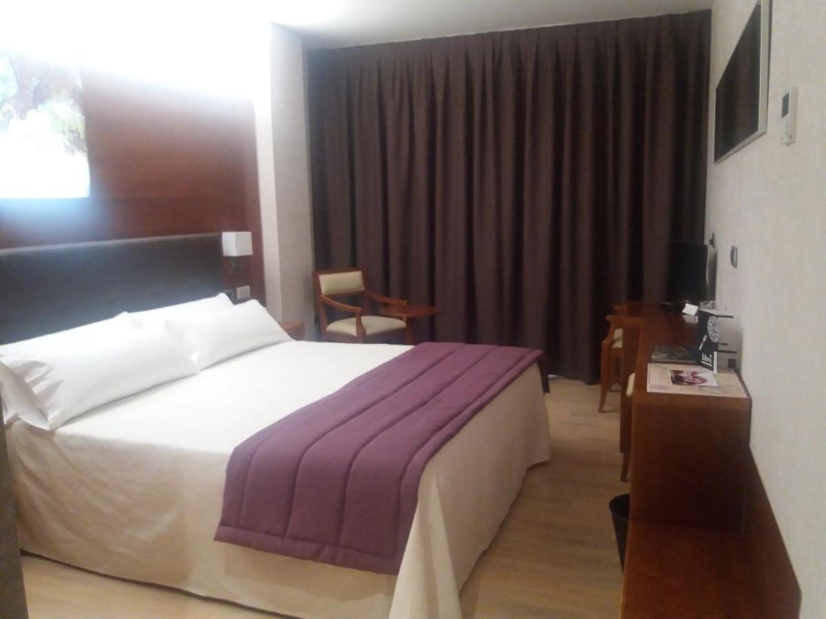 Cama o camas de una habitación en Hotel Balneario Valle del Jerte