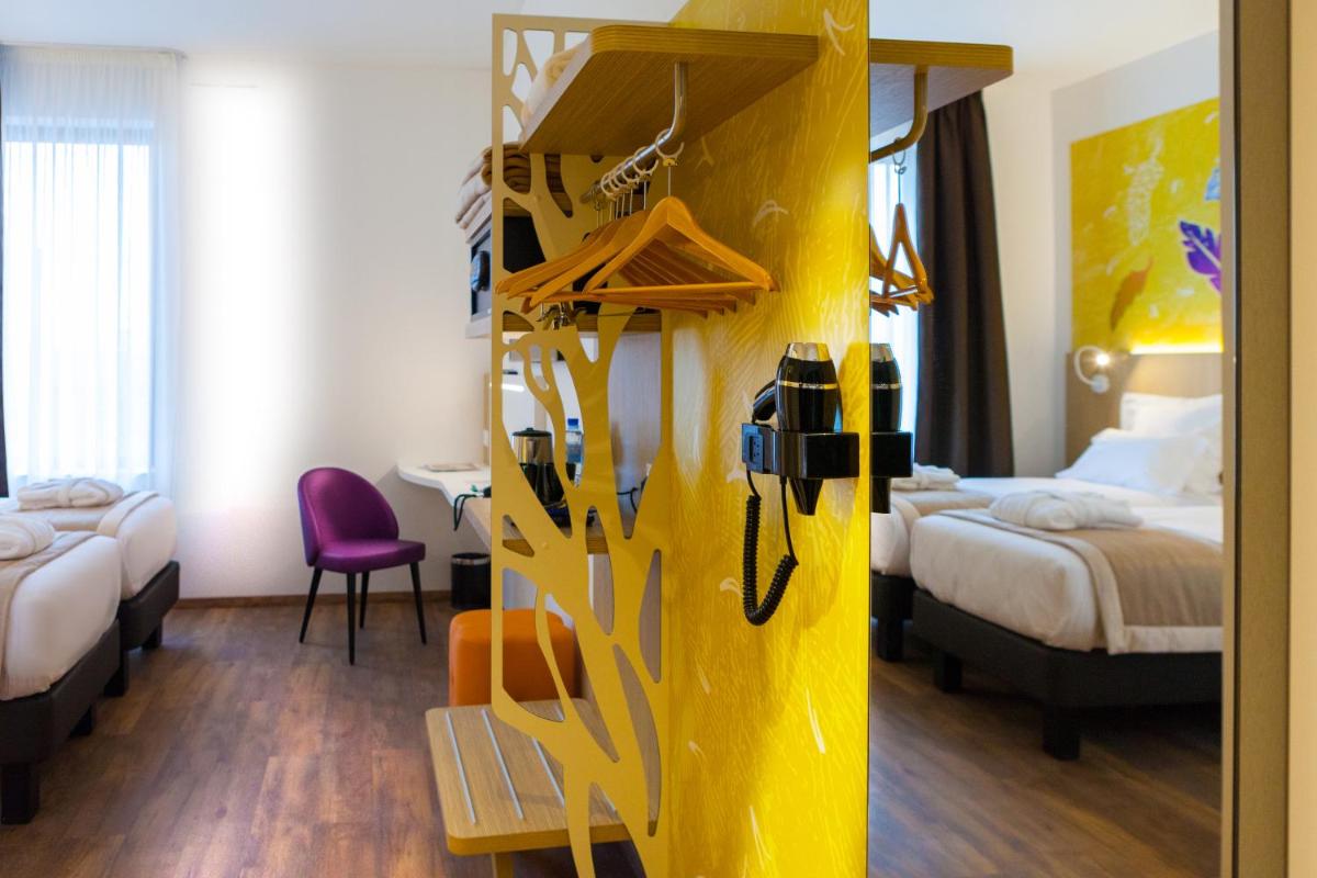 Un ou plusieurs lits dans un hébergement de l'établissement Kyriad Prestige Amiens Poulainville - Hotel and Spa