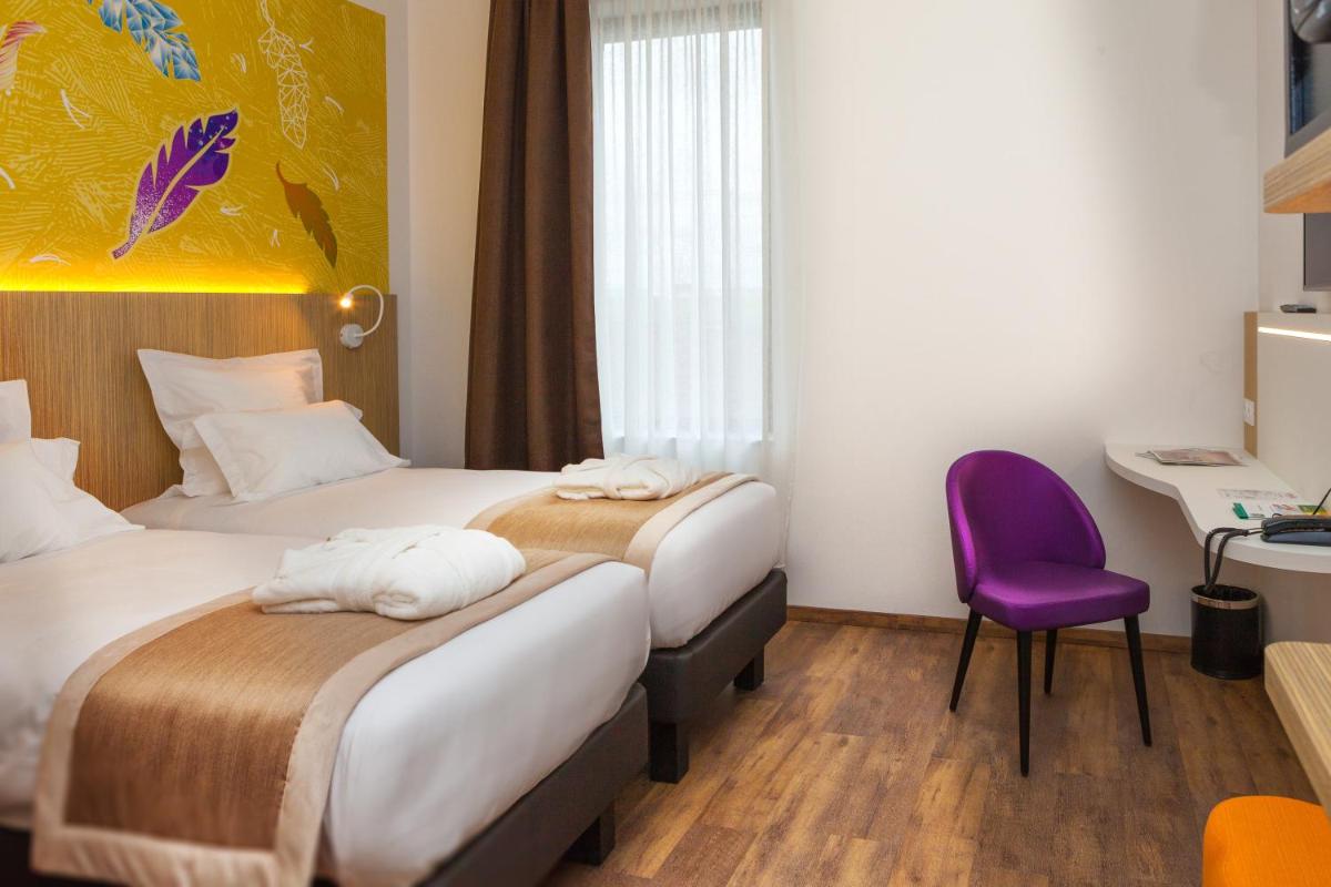 Un ou plusieurs lits dans un hébergement de l'établissement Kyriad Prestige Amiens Poulainville - Hotel and Spa