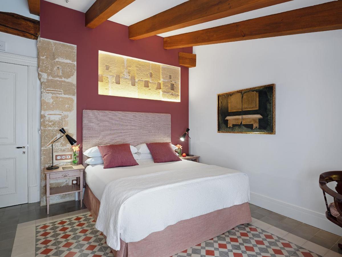 Cama o camas de una habitación en Hotel Gloria de Sant Jaume