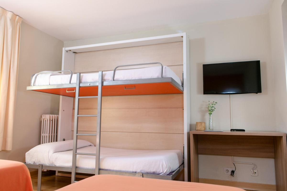 Cama o camas de una habitación en Hotel Snö Condes del Pallars