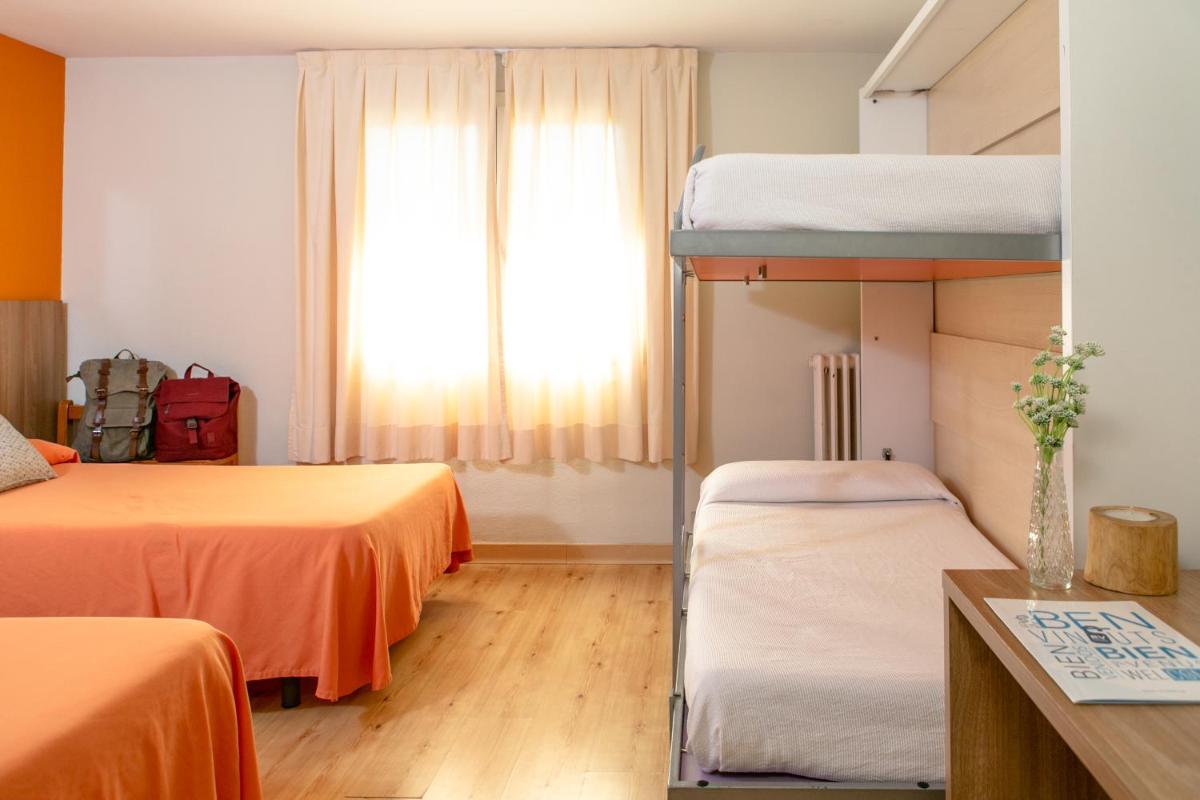 Cama o camas de una habitación en Hotel Snö Condes del Pallars