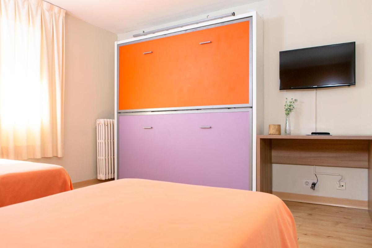Cama o camas de una habitación en Hotel Snö Condes del Pallars