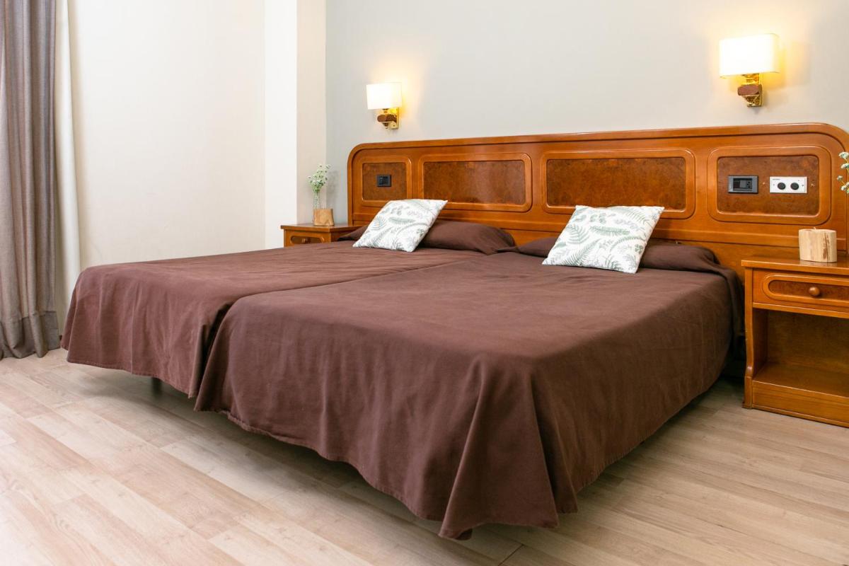 Cama o camas de una habitación en Hotel Snö Condes del Pallars