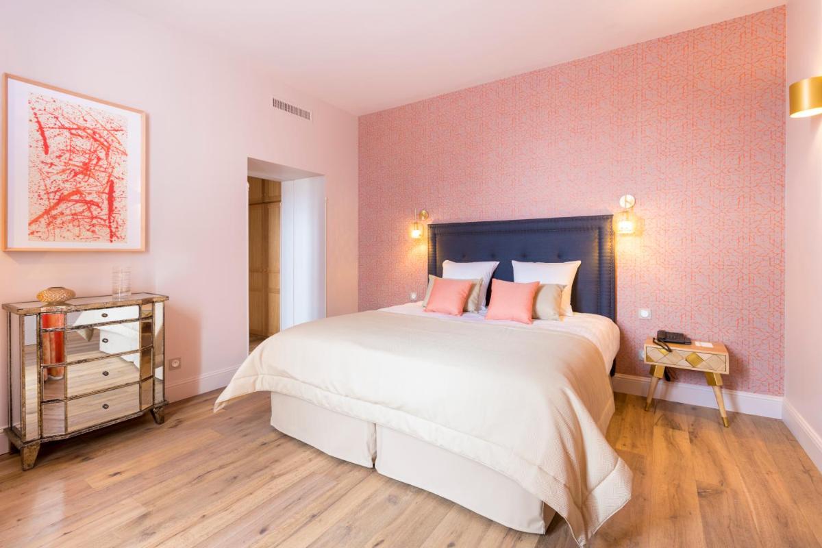 Un ou plusieurs lits dans un hébergement de l'établissement Hotel Clos Castel Villas Spa