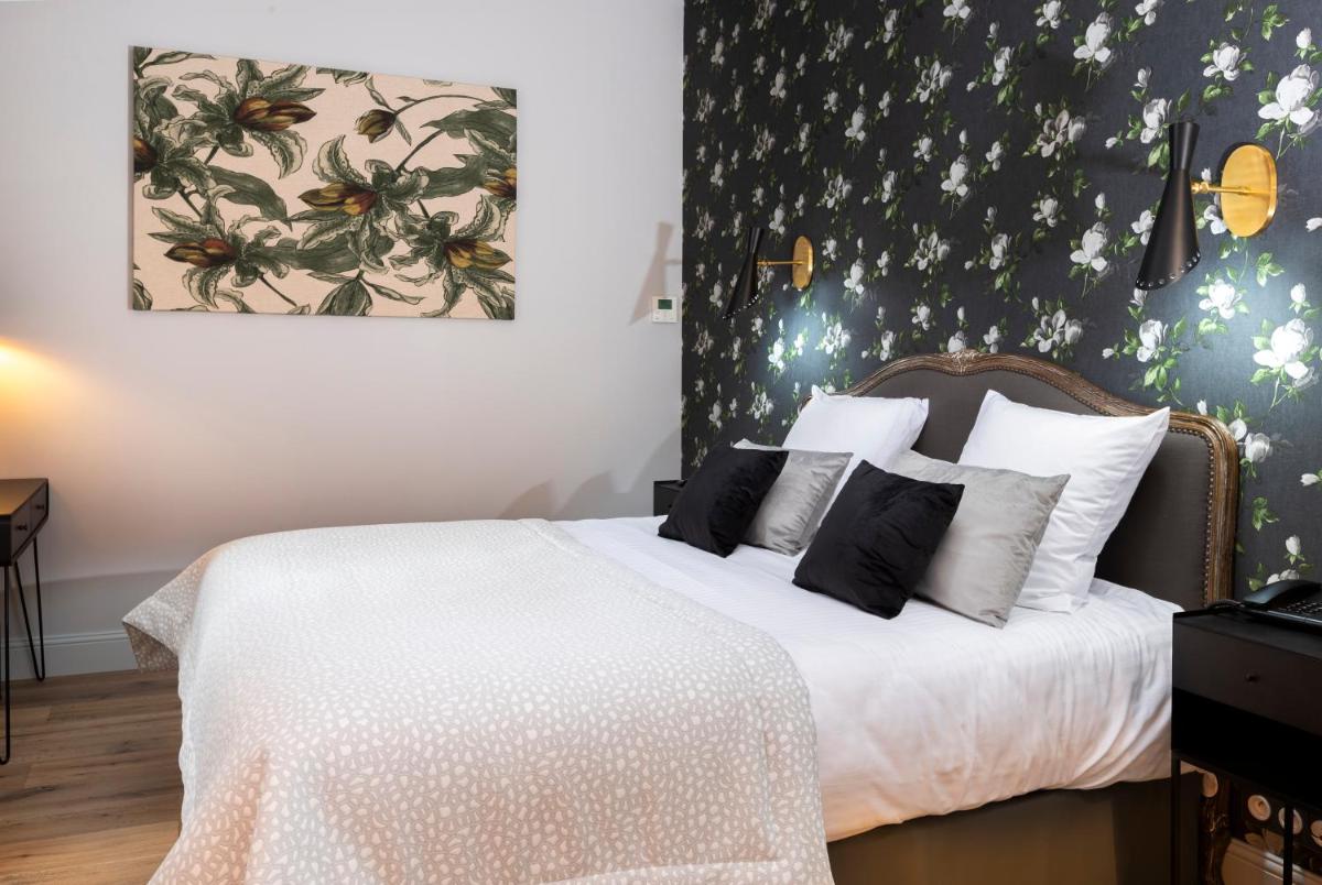 Un ou plusieurs lits dans un hébergement de l'établissement Hotel Clos Castel Villas Spa