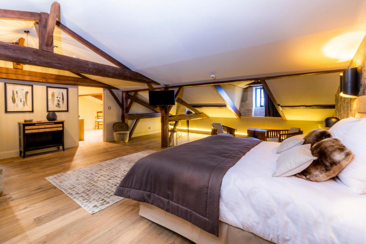 Un ou plusieurs lits dans un hébergement de l'établissement Hotel Clos Castel Villas Spa