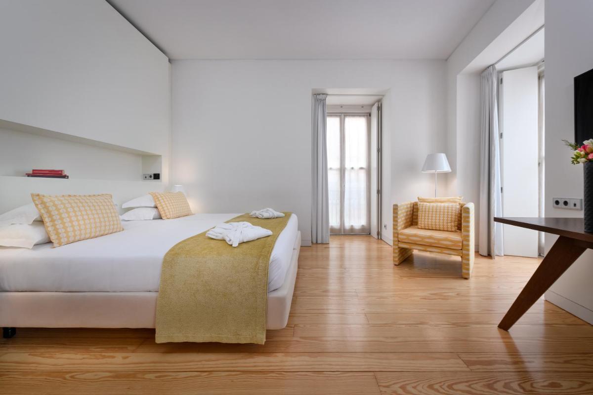 Uma cama ou camas num quarto em Inspira Liberdade Boutique Hotel