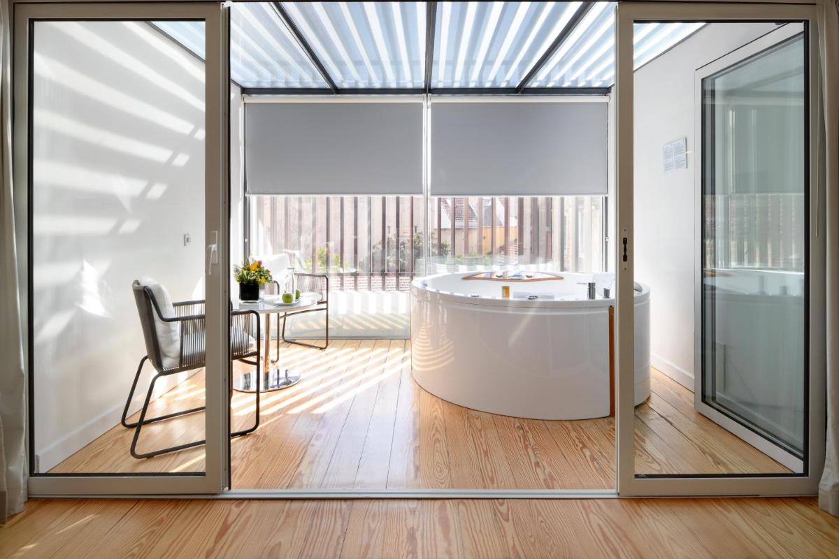 Uma área de estar em Inspira Liberdade Boutique Hotel
