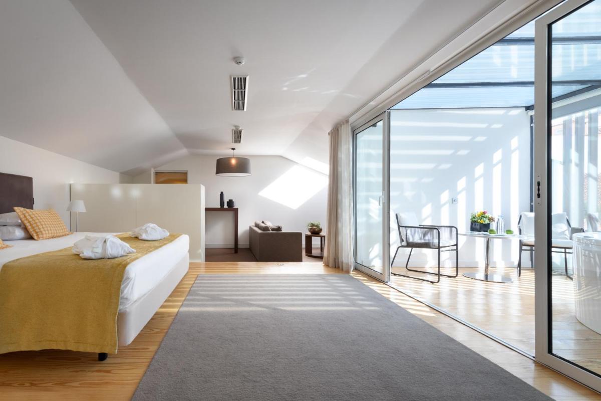 Uma cama ou camas num quarto em Inspira Liberdade Boutique Hotel