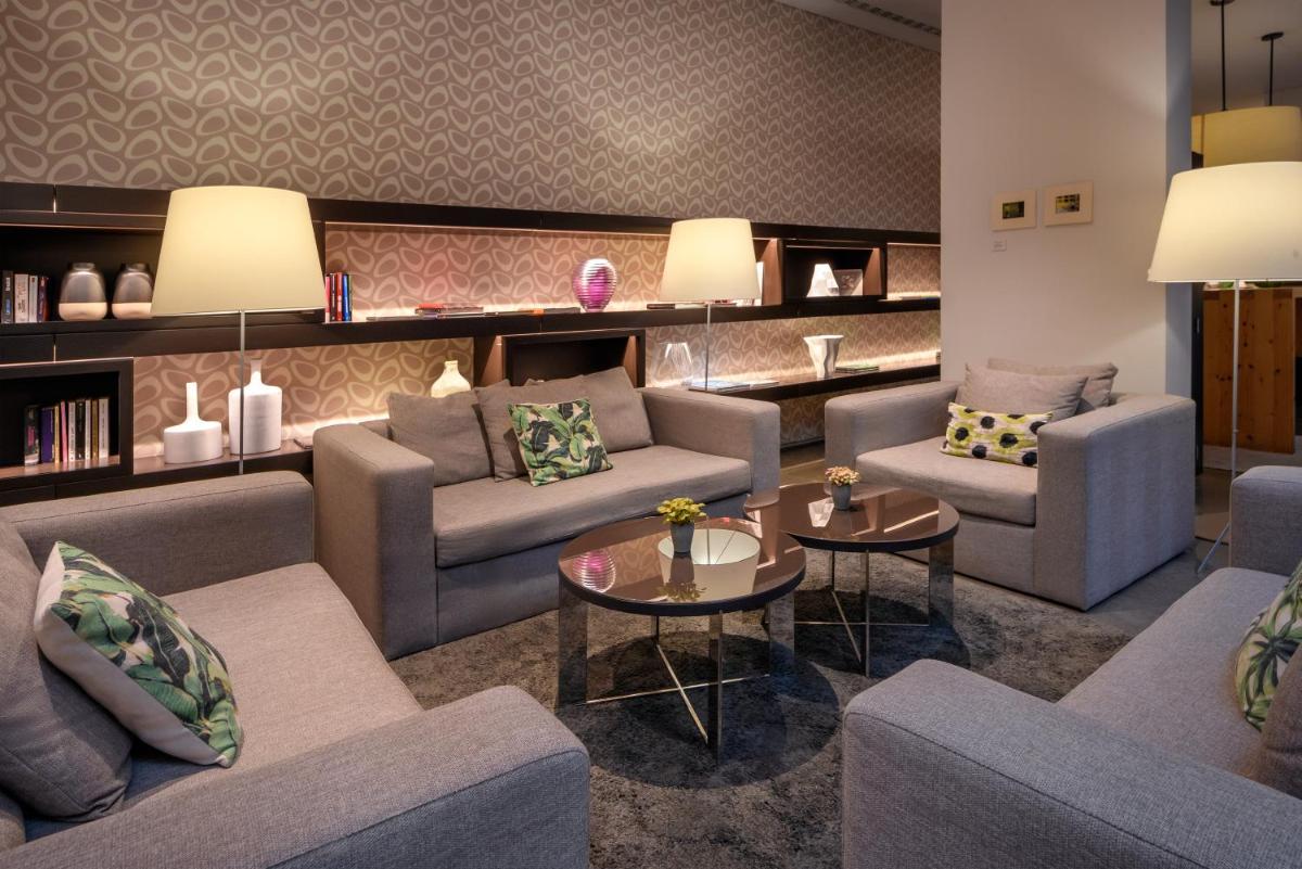 Uma área de estar em Inspira Liberdade Boutique Hotel