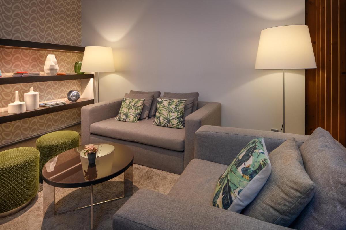 Uma área de estar em Inspira Liberdade Boutique Hotel