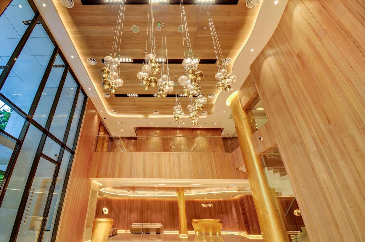 a dining room with a chandelier in a building at Vividus in Bengaluru a dining room with a chandelier in a building at Vividus in Bengaluru